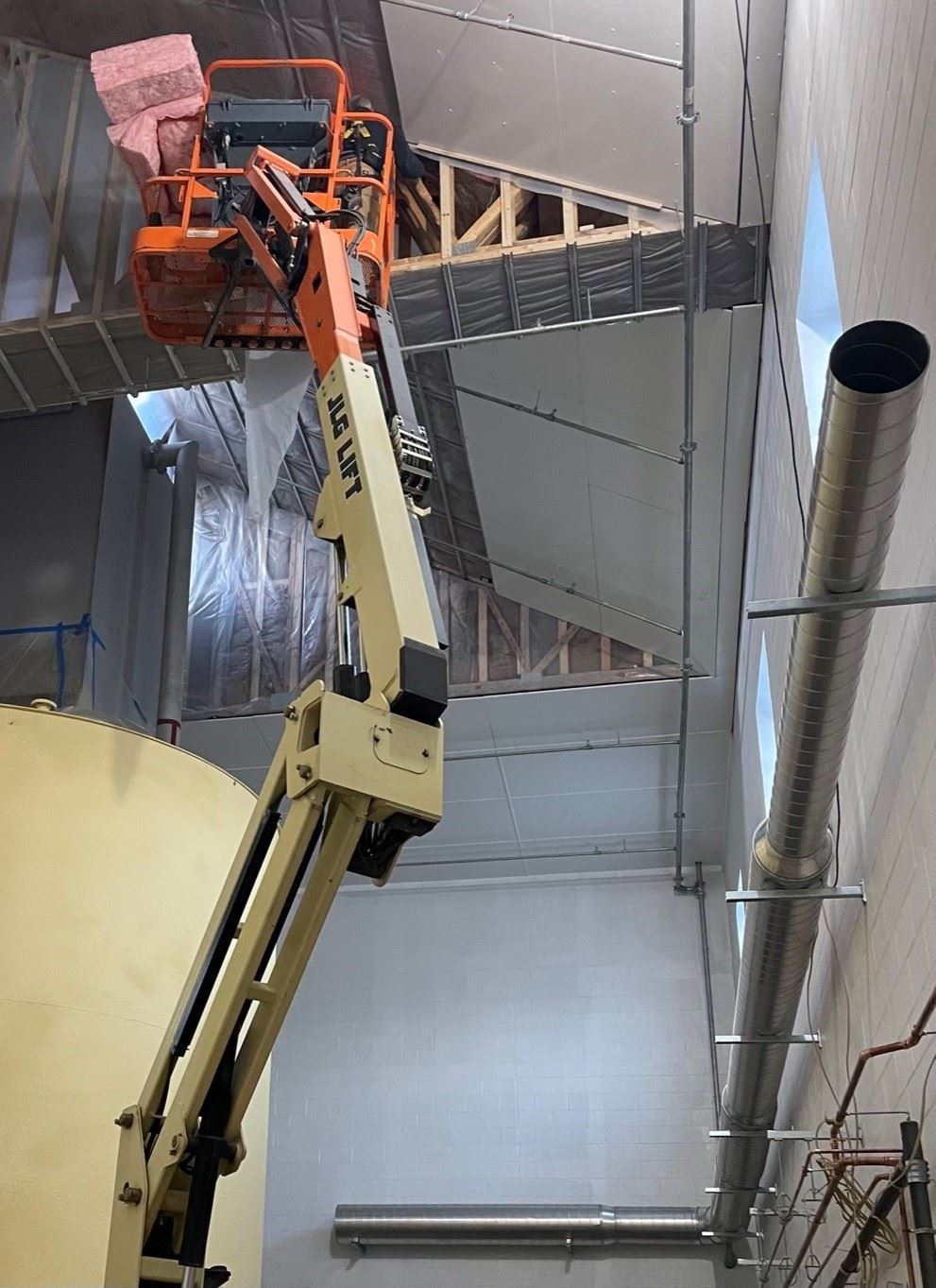 Installation of Insulation, Vapor Barrier and FRP Ceiling Panels